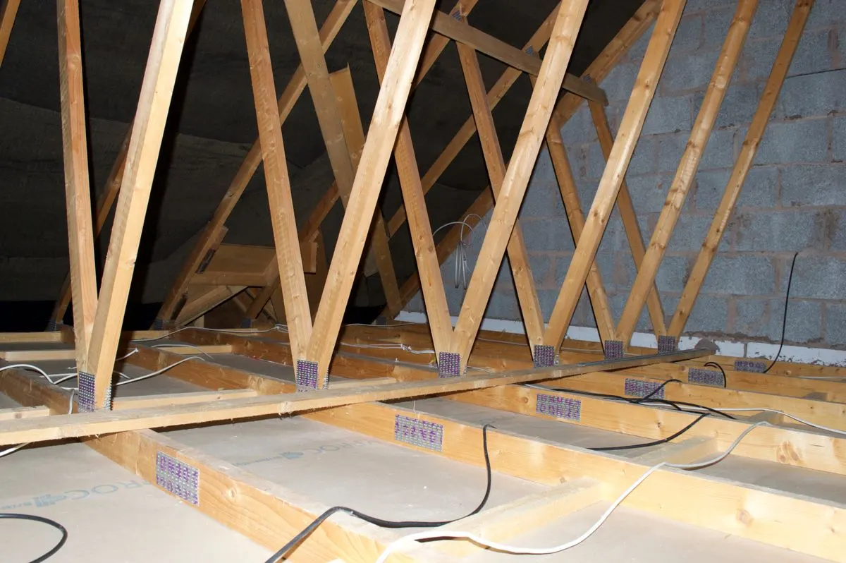 Roof trusses and insulation inside a residential attic