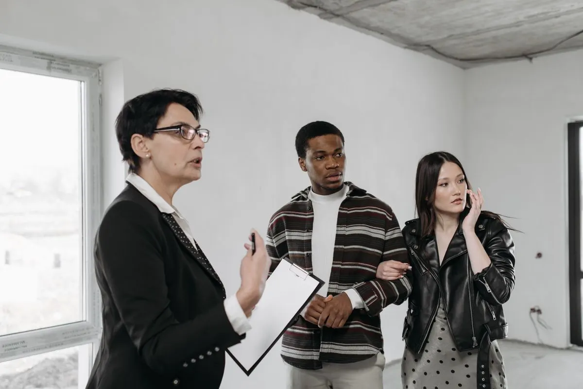 Buyers walking through a home with the inspector