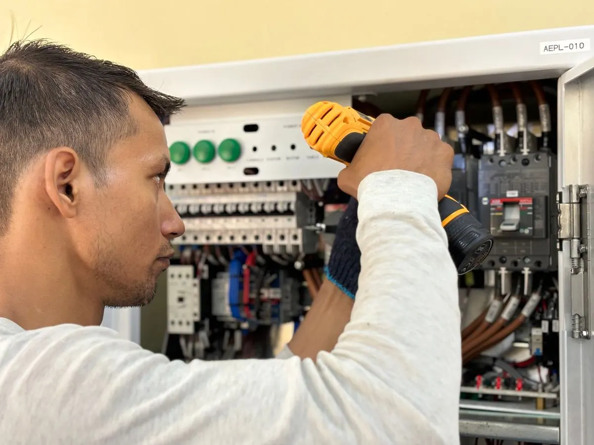 Open residential electrical panel showing breakers and wiring