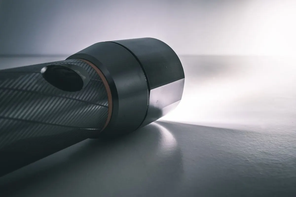 Flashlight beam lighting a dark corner, showing the limits of a visual inspection