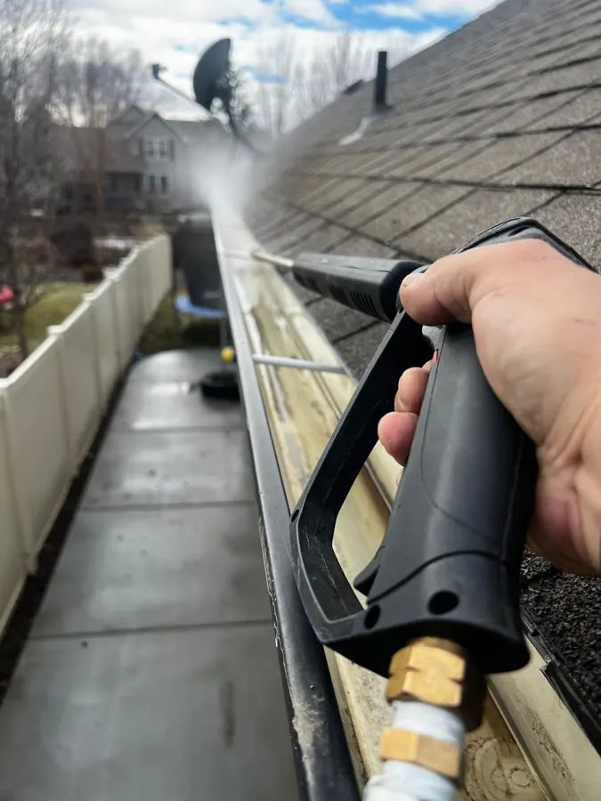 Eavestrough and downspout on the corner of a house